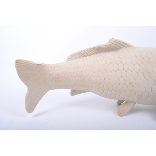 258 - A large contemporary hand moulded gesso / plaster sculpture of koi fish carp. The figure with molded... 