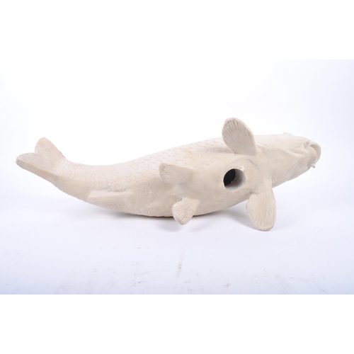 258 - A large contemporary hand moulded gesso / plaster sculpture of koi fish carp. The figure with molded... 