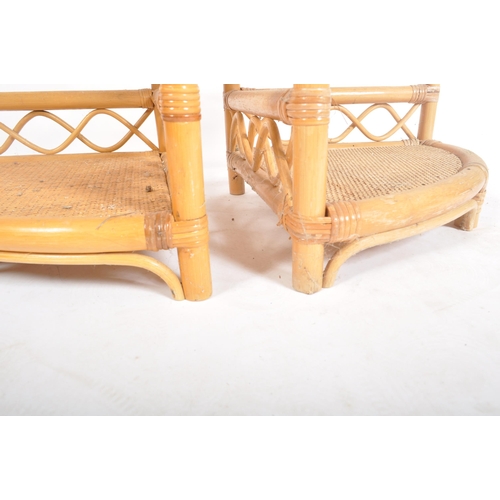 268 - A pair of retro vintage 20th century wicker rattan corner shelves having five shelves with fitted ga... 