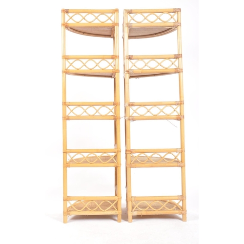 268 - A pair of retro vintage 20th century wicker rattan corner shelves having five shelves with fitted ga... 