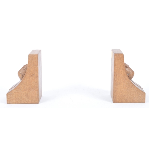 27 - Robert ' Mouseman ' Thompson of Kilburn - A pair of solid English oak hand carved bookends. Each boo... 