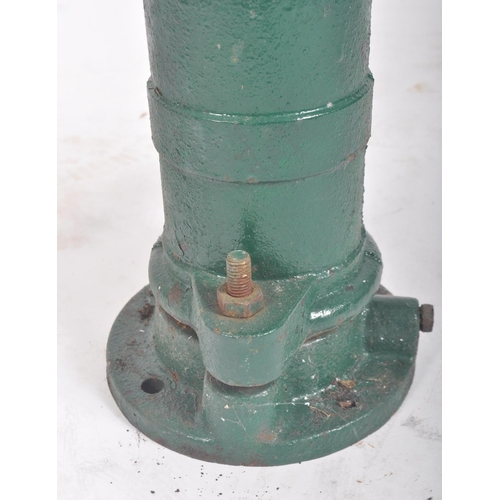 297 - A vintage 20th century cast iron floor exterior garden feature water pump. The cast iron pump painte... 