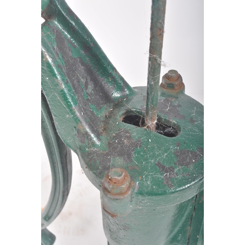 297 - A vintage 20th century cast iron floor exterior garden feature water pump. The cast iron pump painte... 