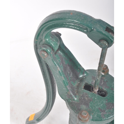 297 - A vintage 20th century cast iron floor exterior garden feature water pump. The cast iron pump painte... 