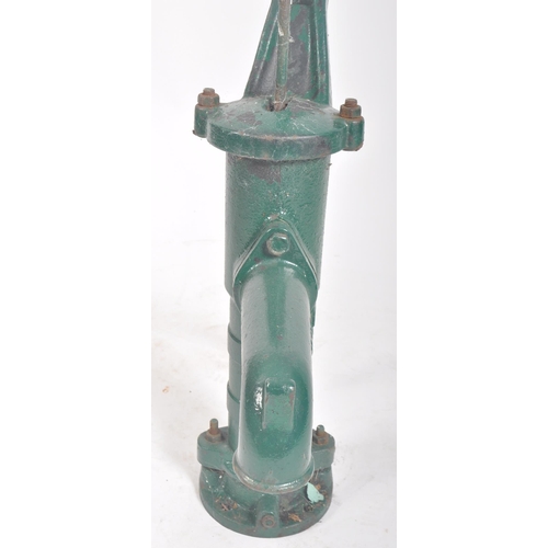 297 - A vintage 20th century cast iron floor exterior garden feature water pump. The cast iron pump painte... 