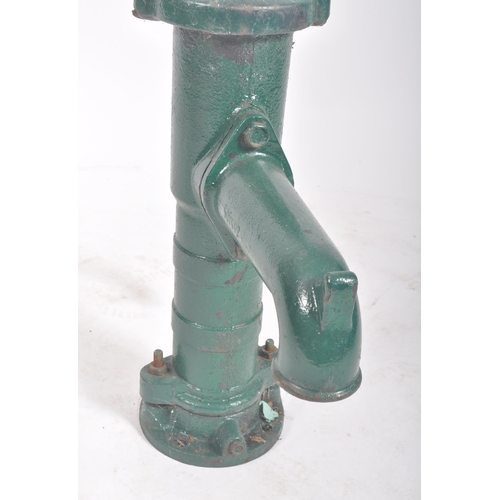 297 - A vintage 20th century cast iron floor exterior garden feature water pump. The cast iron pump painte... 