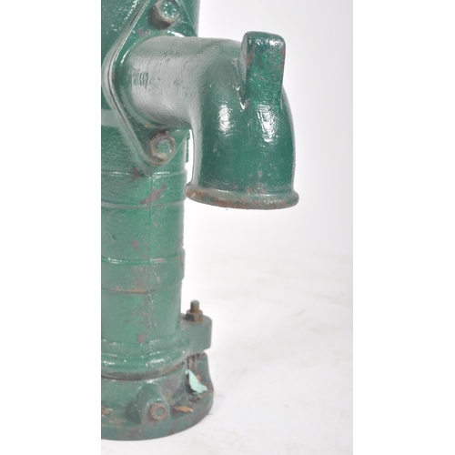 297 - A vintage 20th century cast iron floor exterior garden feature water pump. The cast iron pump painte... 