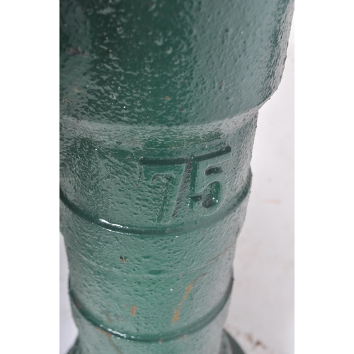 297 - A vintage 20th century cast iron floor exterior garden feature water pump. The cast iron pump painte... 