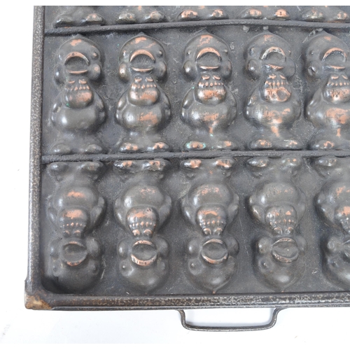 31 - A retro 20th century copper and cast iron chocolate mould, featuring three lines of chirping chicks ... 