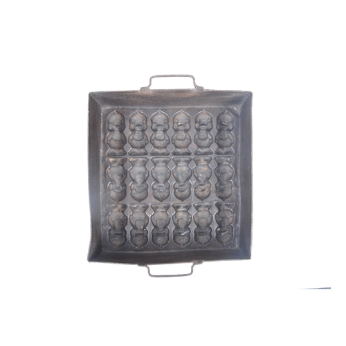 31 - A retro 20th century copper and cast iron chocolate mould, featuring three lines of chirping chicks ... 