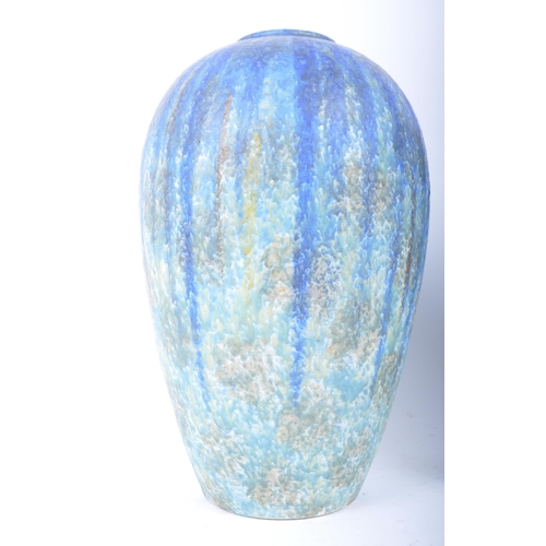 410 - A pair of early 20th century circa 1900 Bretby of Barnstaple, Devon studio art pottery vases. Each o... 