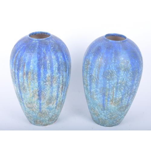410 - A pair of early 20th century circa 1900 Bretby of Barnstaple, Devon studio art pottery vases. Each o... 