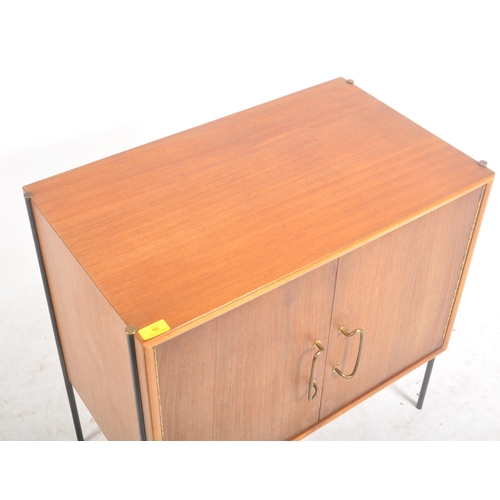 66 - Peter Hayward for Vanson - A retro mid 20th century teak cupboard cabinet having twin doors cupboard... 