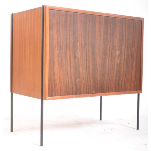 66 - Peter Hayward for Vanson - A retro mid 20th century teak cupboard cabinet having twin doors cupboard... 