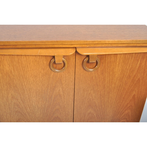 69 - Beautility - A retro vintage 20th century 1970s teak wood sideboard credenza. The sideboard having a... 