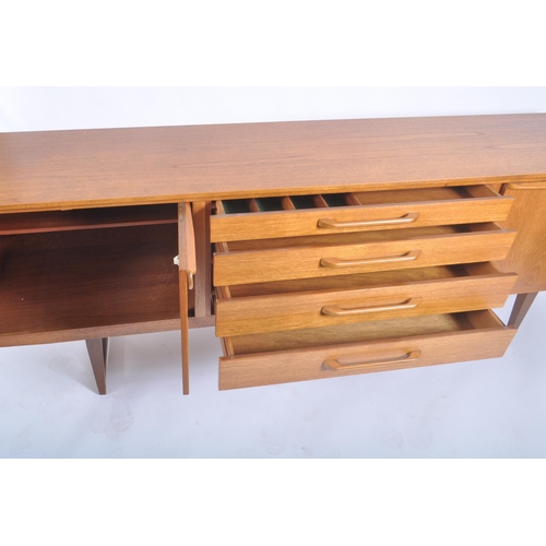 69 - Beautility - A retro vintage 20th century 1970s teak wood sideboard credenza. The sideboard having a... 