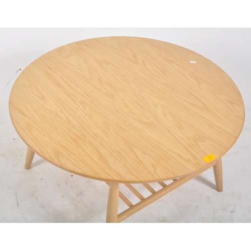 74 - Ercol - Shalstone - A contemporary designer solid oak coffee table / low table having a circular tab... 