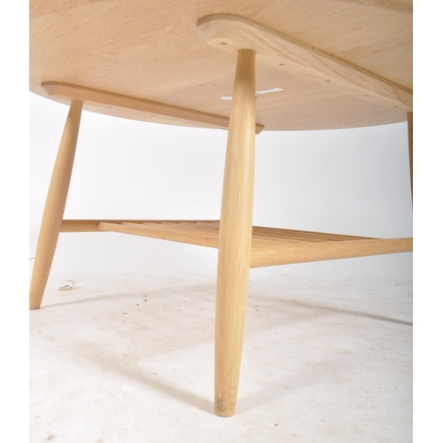 74 - Ercol - Shalstone - A contemporary designer solid oak coffee table / low table having a circular tab... 