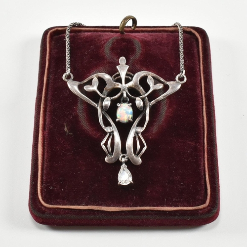 87 - A contemporary Art Nouveau silver & synthetic opal pendant necklace. The necklace strung with a pear... 