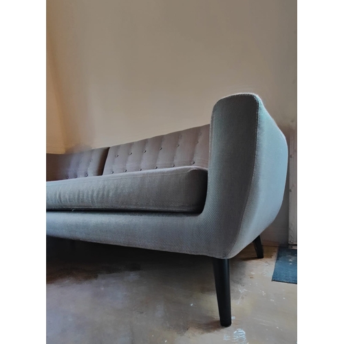 273 - A contemporary Made.com modular corner L shaped sofa settee. The sofa in a grey upholstery with butt... 