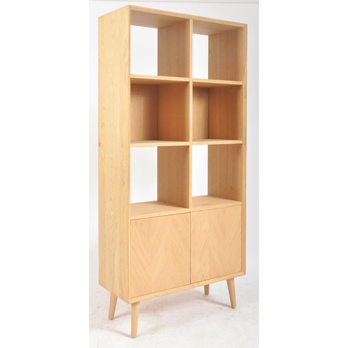 627 - A contemporary Milano solid oak two door open display unit bookcase. The bookcase having straight to... 