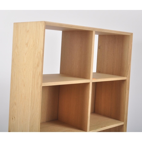627 - A contemporary Milano solid oak two door open display unit bookcase. The bookcase having straight to... 