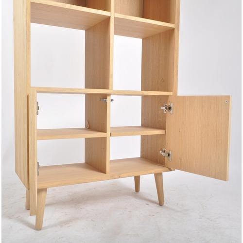 627 - A contemporary Milano solid oak two door open display unit bookcase. The bookcase having straight to... 