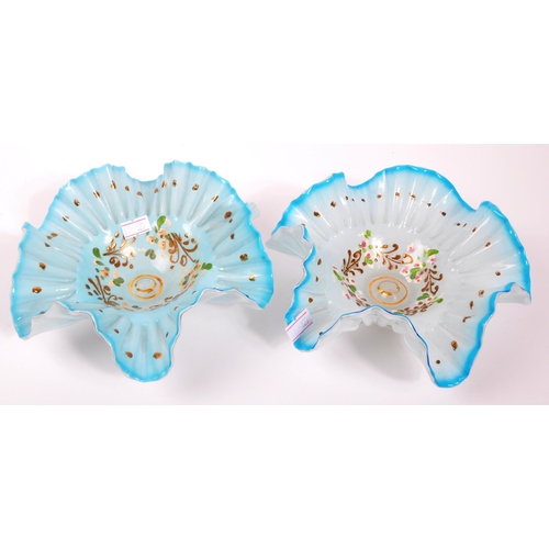 123 - An early 20th Century glass vase with a pair of bon bon dishes. All hand decorated with fauna and fl... 