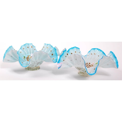 123 - An early 20th Century glass vase with a pair of bon bon dishes. All hand decorated with fauna and fl... 