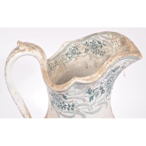 124 - A large early 20th century Victorian ceramic jug of tapering form having applied transfer decoration... 