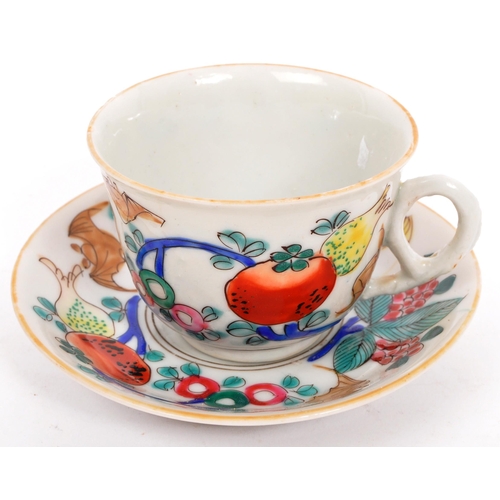 126 - A Chinese / Oriental ceramic porcelain cup and saucer having hand painted multi-coloured foliate and... 