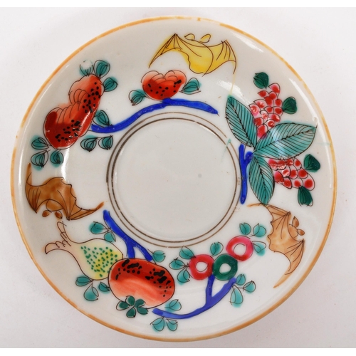 126 - A Chinese / Oriental ceramic porcelain cup and saucer having hand painted multi-coloured foliate and... 