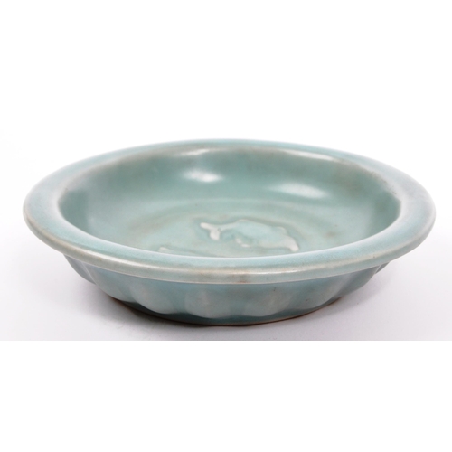 129 - An early 20th century Chinese / Oriental ceramic pottery artists brush bowl / dish in a green colour... 