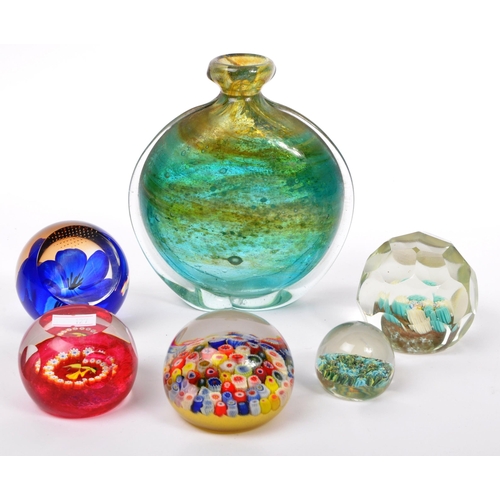 130 - A collection of five vintage mid 20th century paperweights by Caithness along with a Mdina bud vase.... 