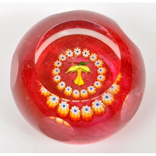 130 - A collection of five vintage mid 20th century paperweights by Caithness along with a Mdina bud vase.... 