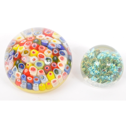 130 - A collection of five vintage mid 20th century paperweights by Caithness along with a Mdina bud vase.... 