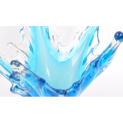 143 - A large 20th century studio glass centrepiece splash vase. The vase having varying tones of blue mod... 