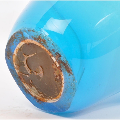 143 - A large 20th century studio glass centrepiece splash vase. The vase having varying tones of blue mod... 