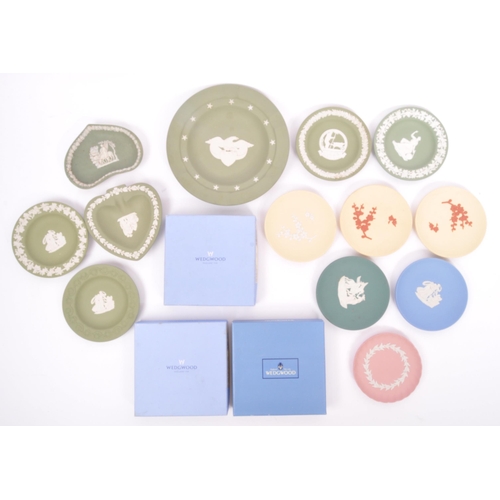 151 - Wedgwood - A collection of 20th century Wedgwood jasperware in sage green to include classical scene... 