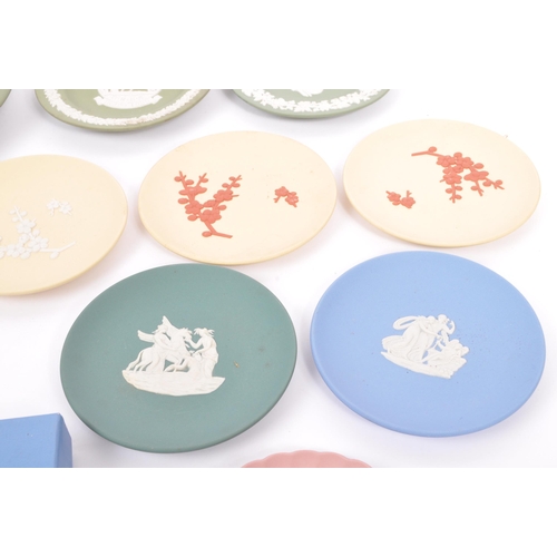 151 - Wedgwood - A collection of 20th century Wedgwood jasperware in sage green to include classical scene... 