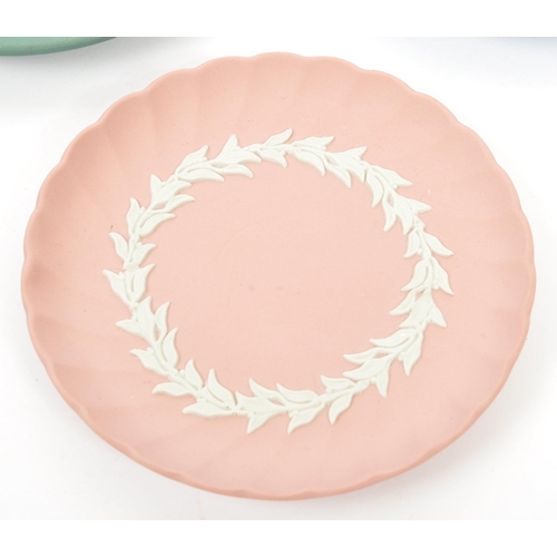 151 - Wedgwood - A collection of 20th century Wedgwood jasperware in sage green to include classical scene... 