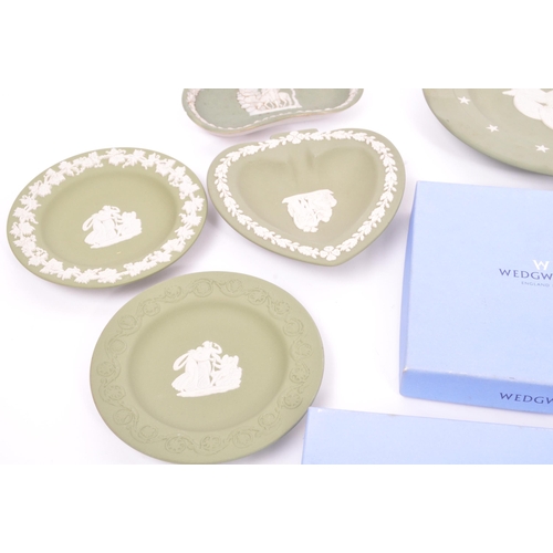151 - Wedgwood - A collection of 20th century Wedgwood jasperware in sage green to include classical scene... 