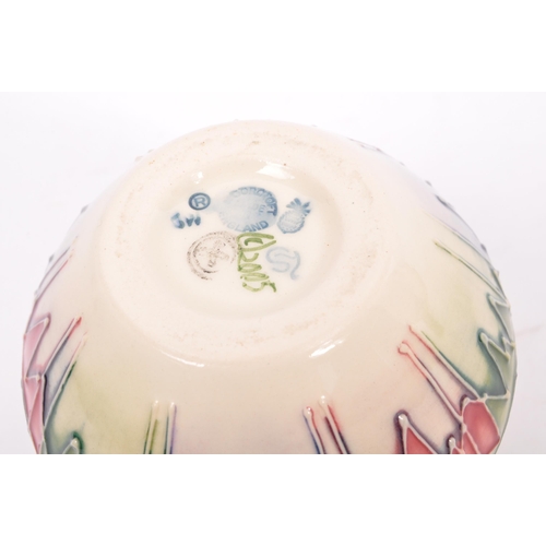 152 - Moorcroft - Candlelight - A 20th century Moorcroft vase in the Candlelight pattern designed by Nicol... 