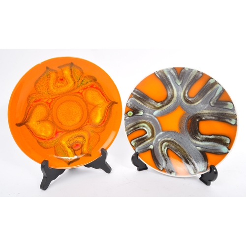 163 - A collection of 4 x retro vintage hand painted plates and bowls in the 'Delphis' design by Poole Pot... 