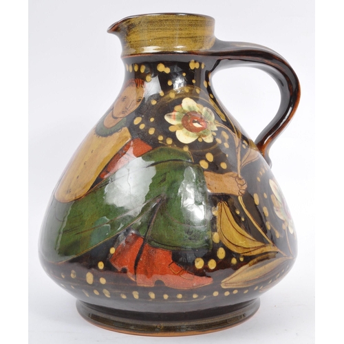 167 - A large Continental ceramic glazed Hans Schneider Folk Art pottery jug of bulbous form together with... 