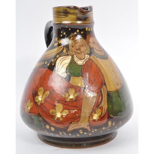 167 - A large Continental ceramic glazed Hans Schneider Folk Art pottery jug of bulbous form together with... 
