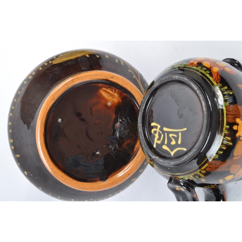 167 - A large Continental ceramic glazed Hans Schneider Folk Art pottery jug of bulbous form together with... 