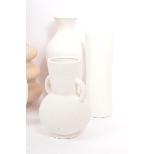 169 - A large collection of vintage 20th century and contemporary studio pottery to include a circular orn... 