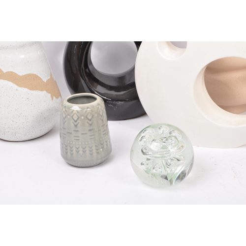 169 - A large collection of vintage 20th century and contemporary studio pottery to include a circular orn... 