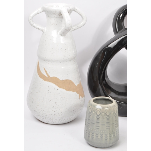 169 - A large collection of vintage 20th century and contemporary studio pottery to include a circular orn... 